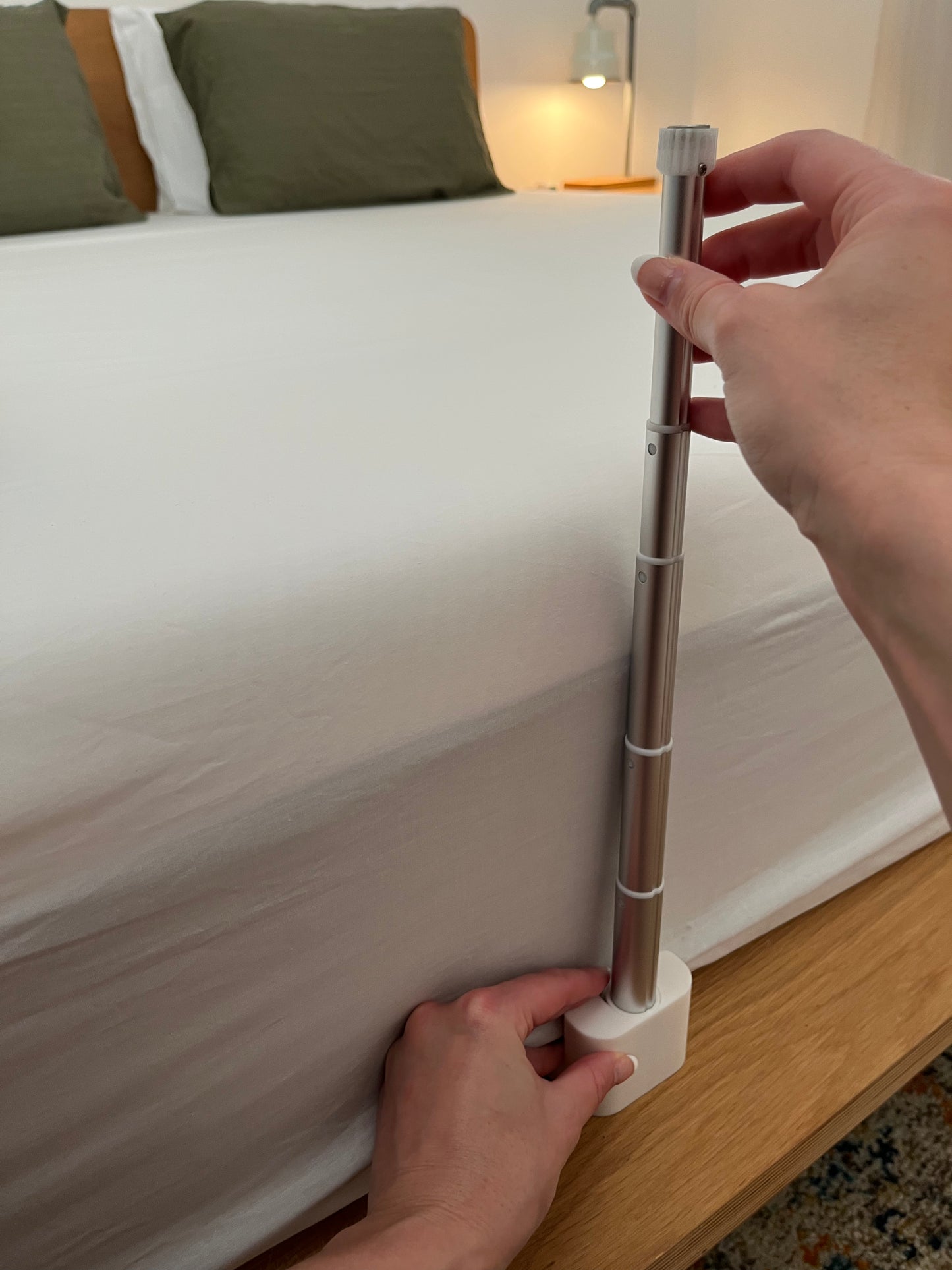 Fantail quiet bed fan cooling a hot sleeper under the sheets