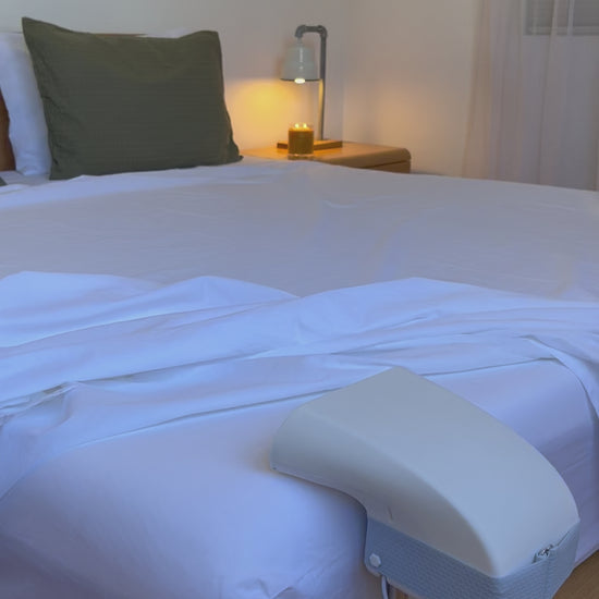 Fantail quiet bed fan cooling a hot sleeper under the sheets