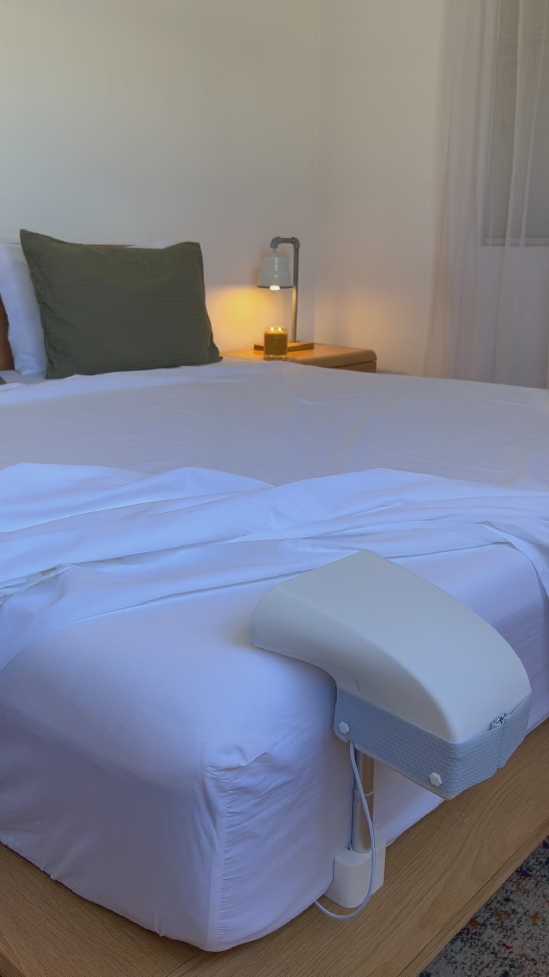 Fantail quiet bed fan cooling a hot sleeper under the sheets