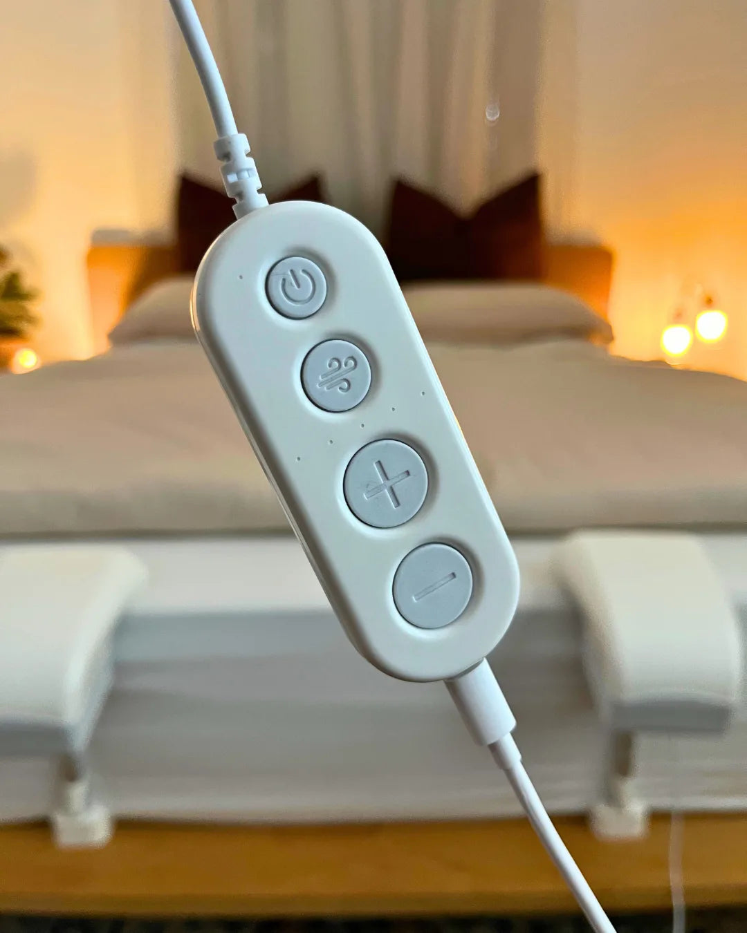 Fantail's bedside remote control hanging beside the bed